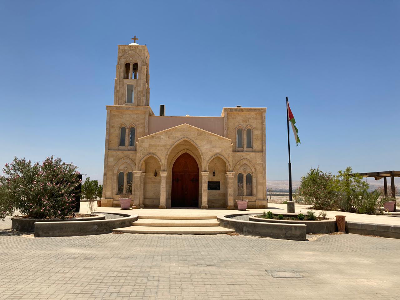 Front facade of the Baptist site church with symmetrical arched entrance